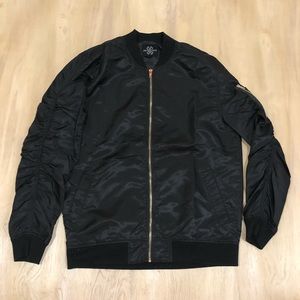 Black Bomber from Jay Walker with ruffled arms.